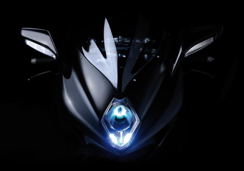 motorcycle headlight in darkness