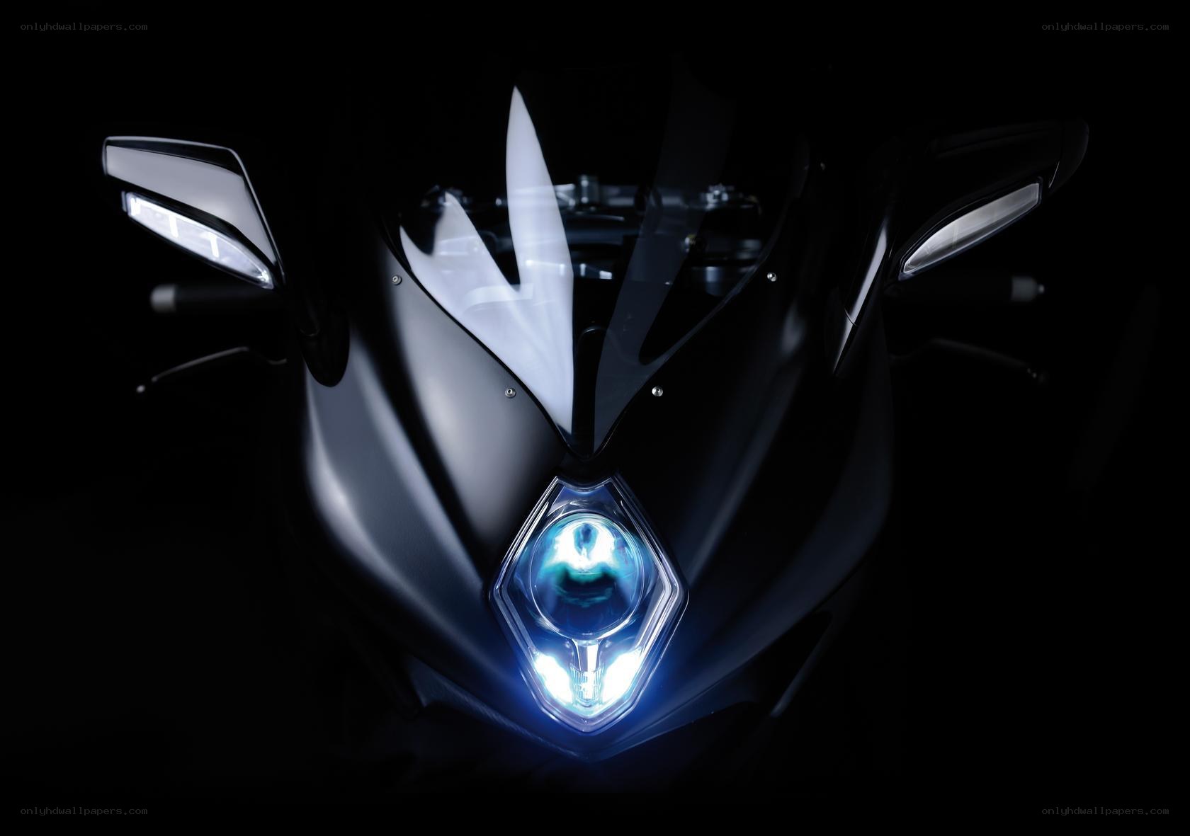 motorcycle headlight in darkness