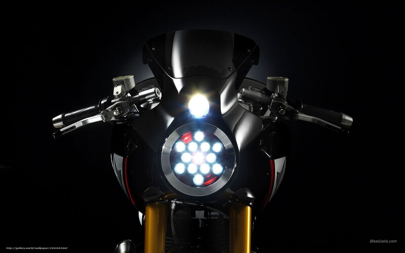 motorcycle headlight in darkness