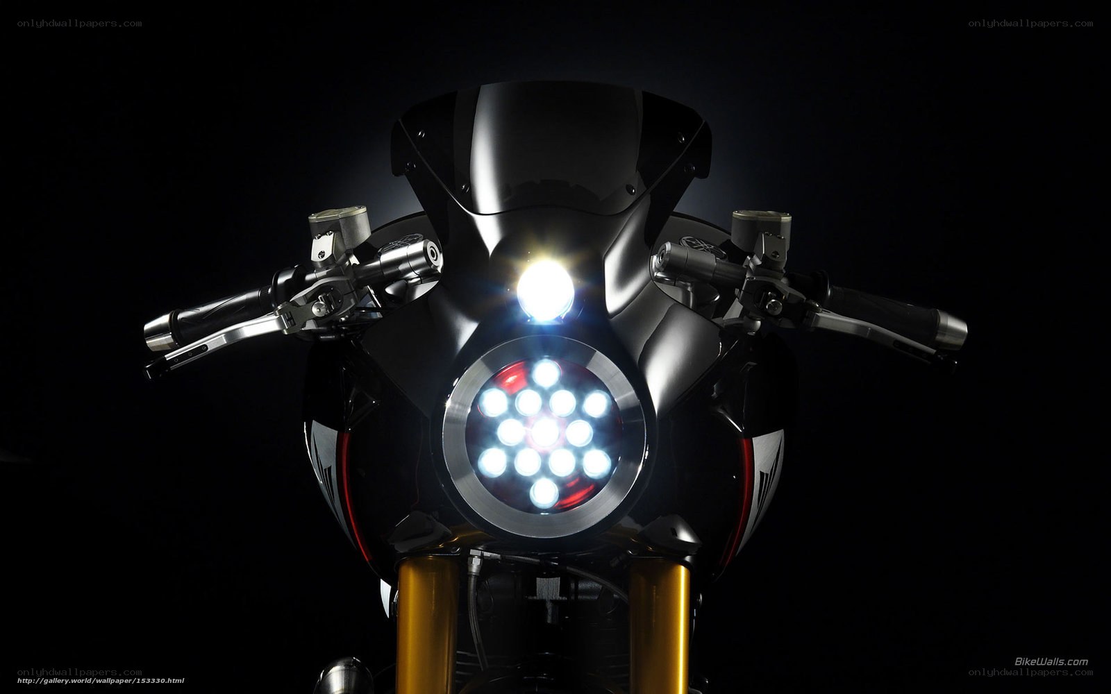 motorcycle headlight in darkness