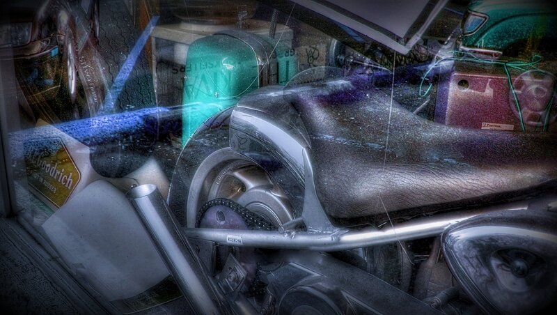 motorcycle in a cluttered garage
