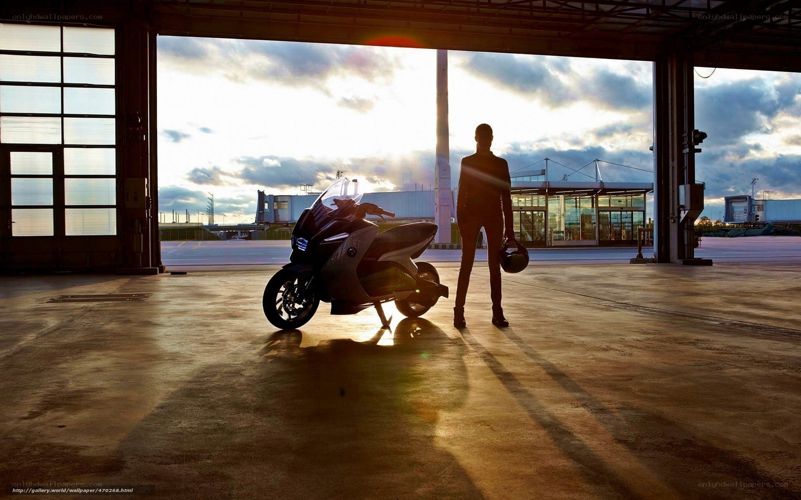 Motorcycle in a hangar at sunset