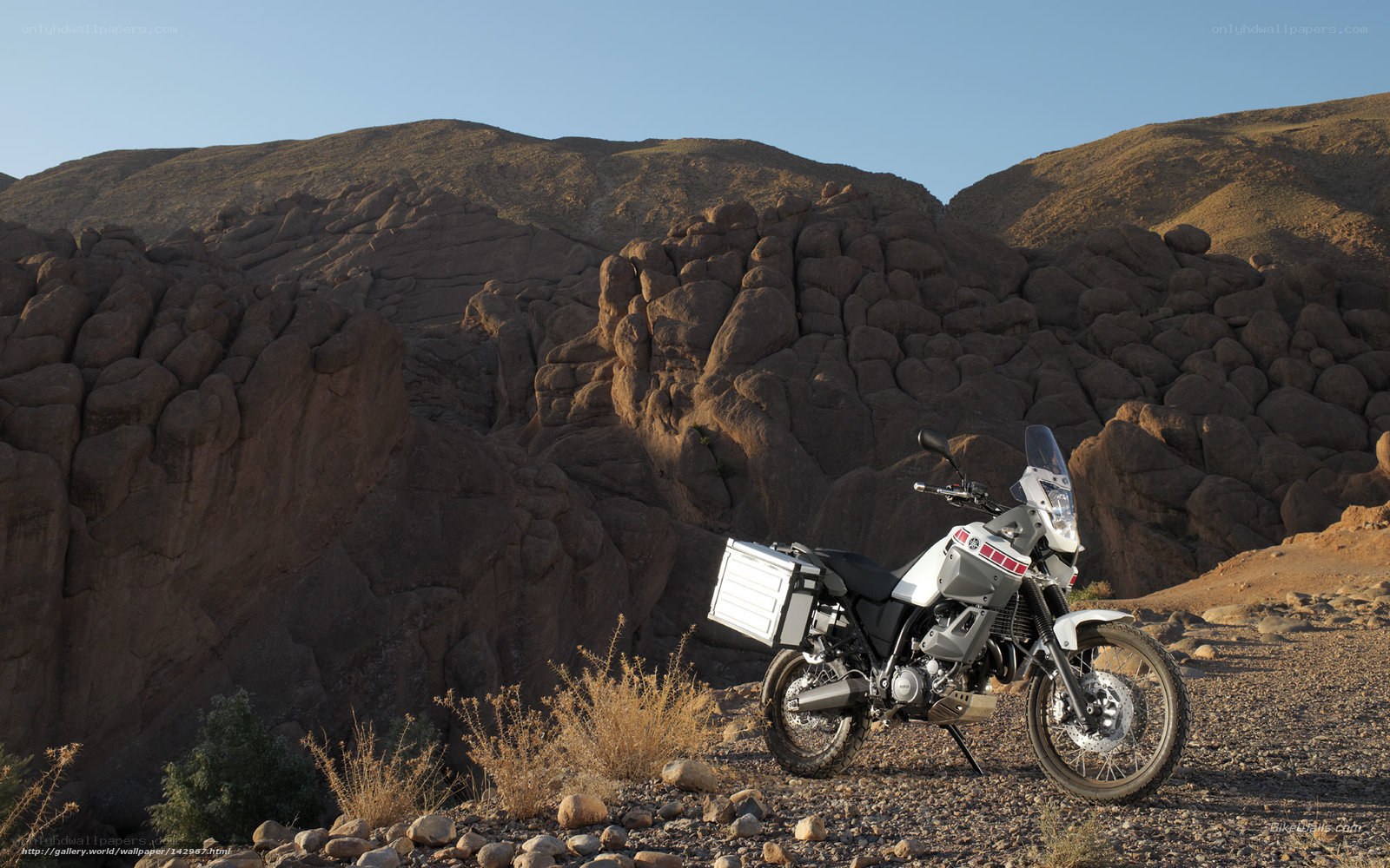 motorcycle in desert canyon