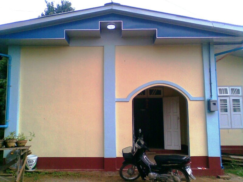 Motorcycle in Front of House