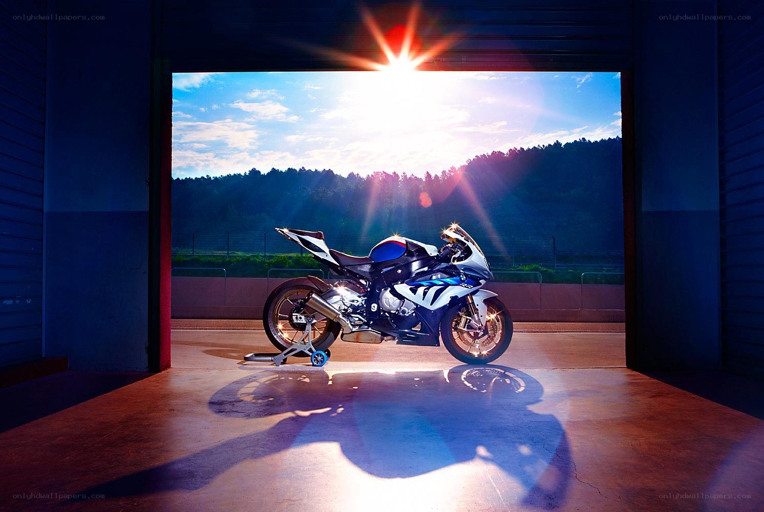 motorcycle in garage at sunset