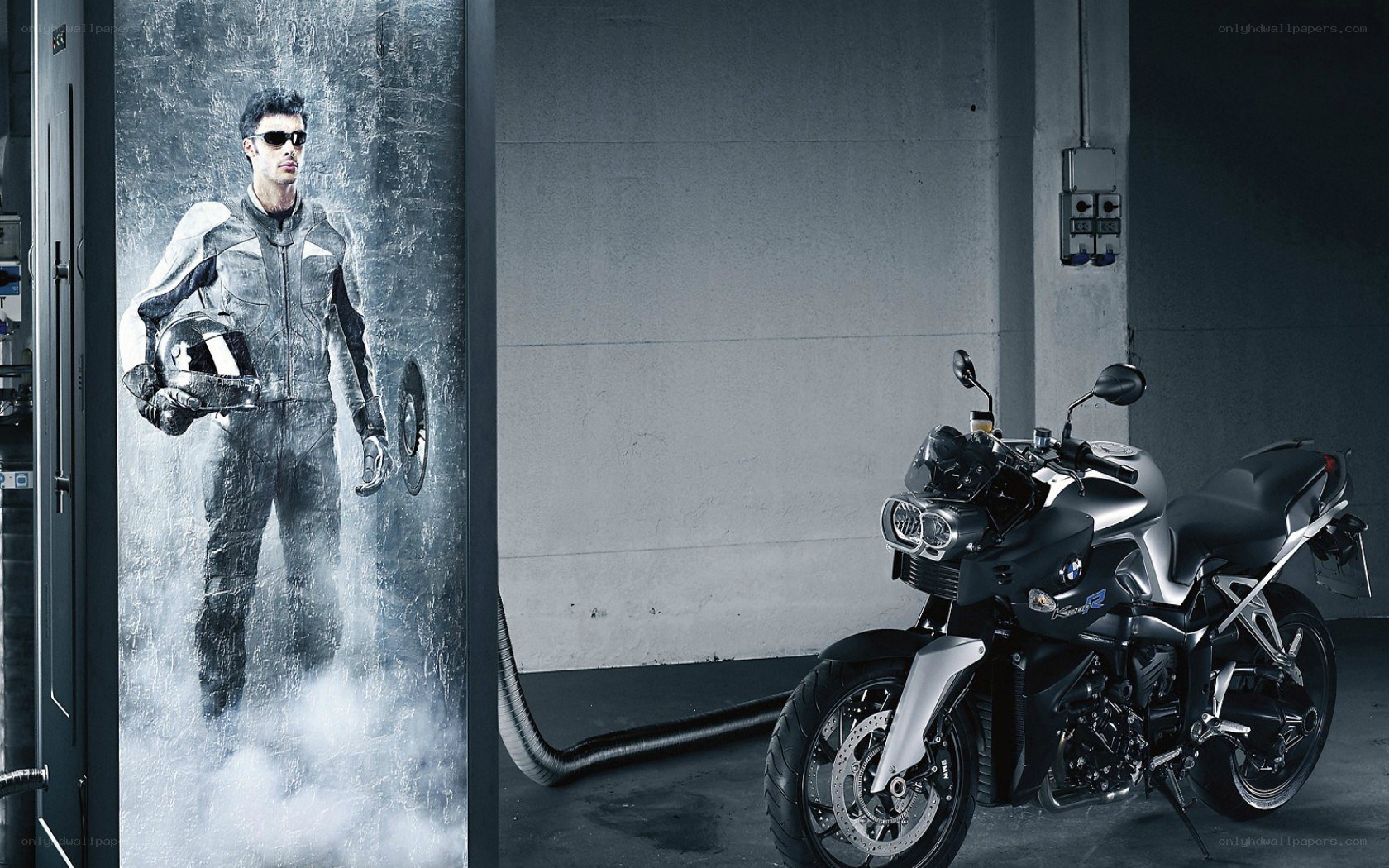 motorcycle in garage with rider image