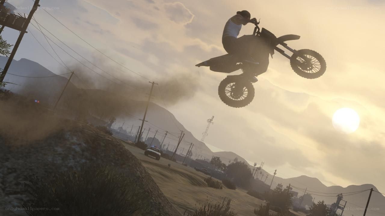motorcycle jump at sunset