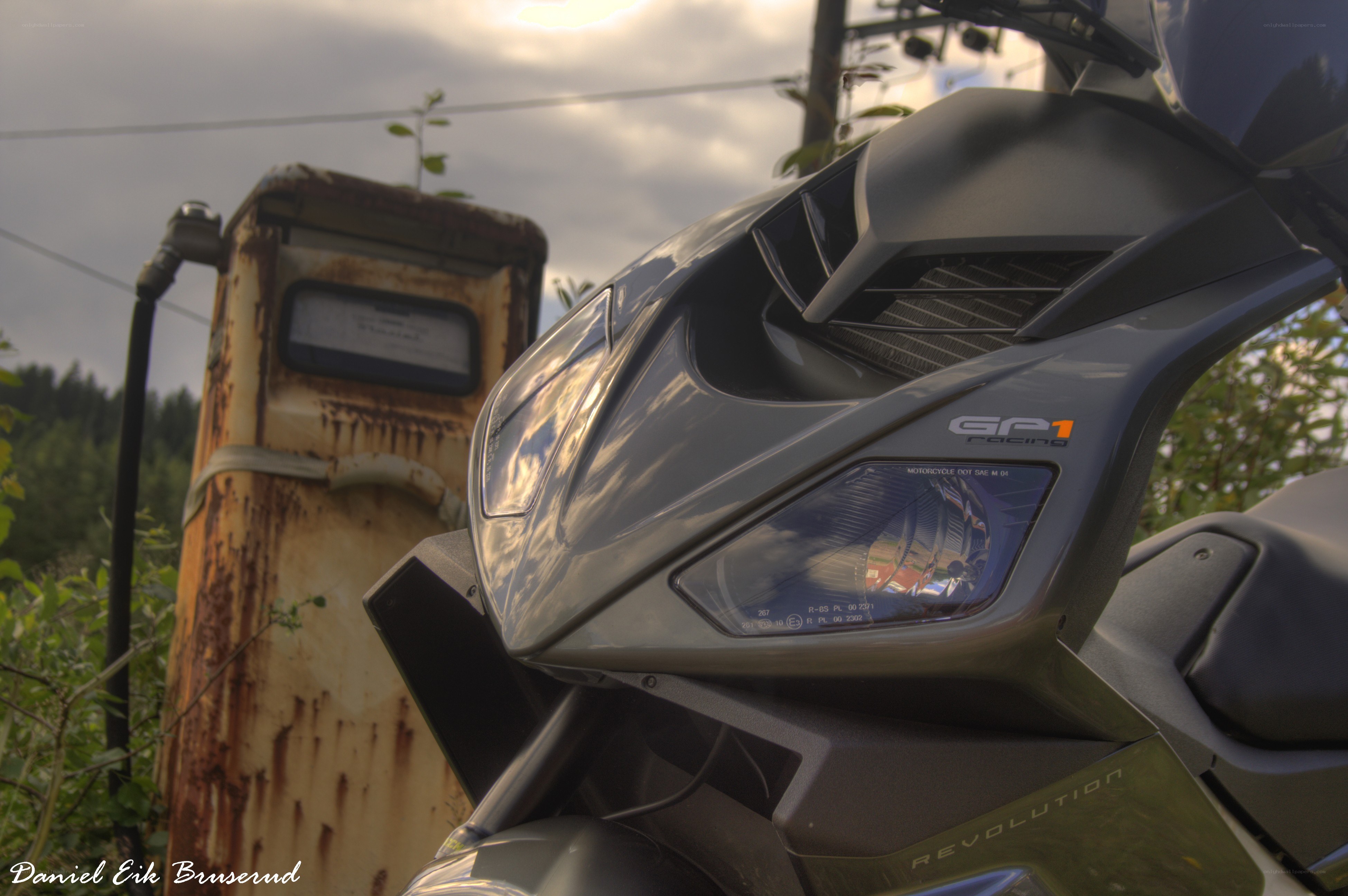 motorcycle near old gas pump