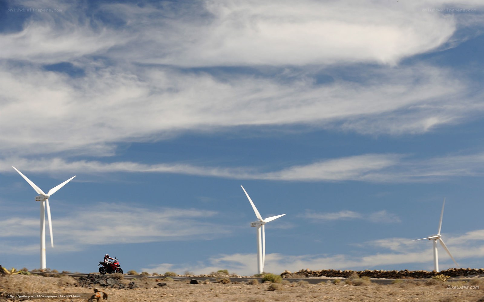 Motorcycle near wind turbines