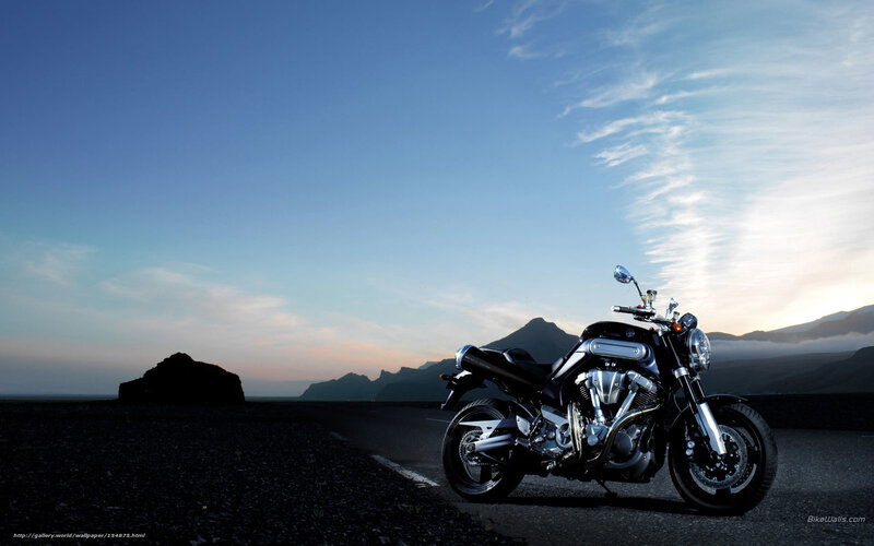 motorcycle on a road at sunset