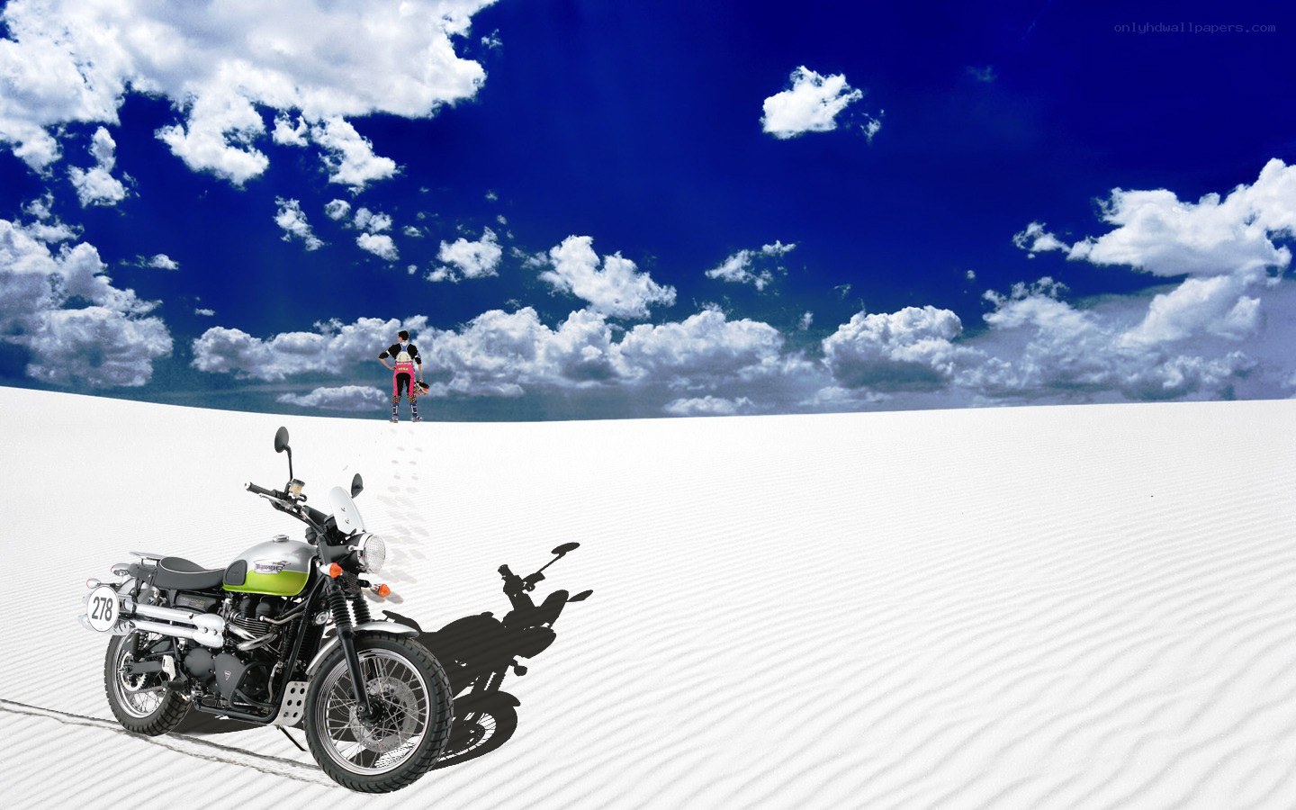 Motorcycle on a white dune