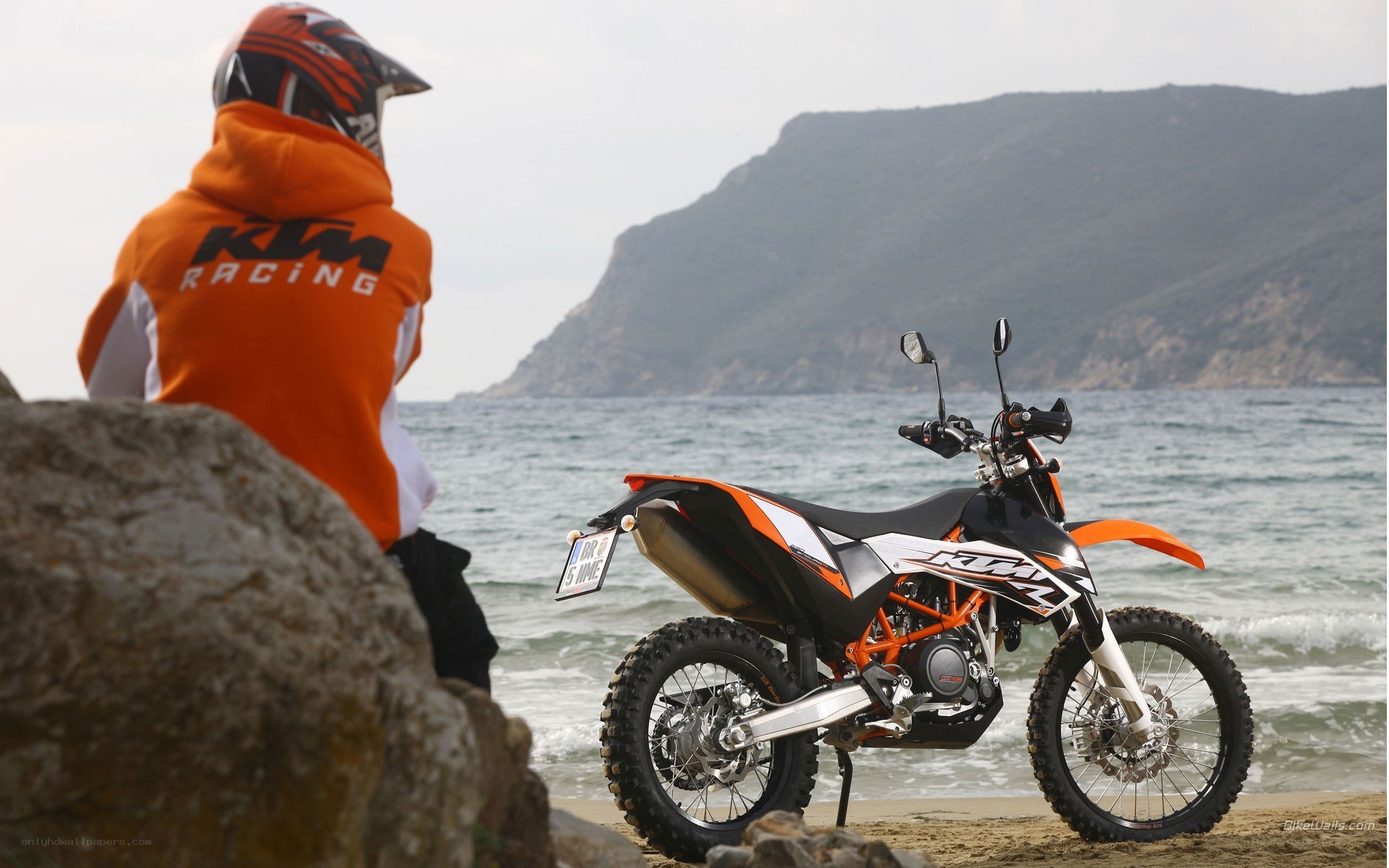 Motorcycle on beach with rider