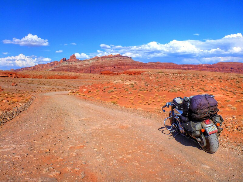 Motorcycle on Desert Road — Blue, Serene, Afternoon