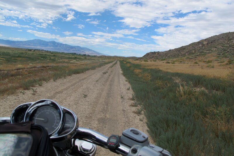 Motorcycle on Dirt Road — Blue