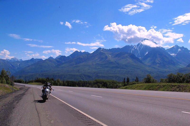Motorcycle on Mountain Road — Blue, Serene, Afternoon