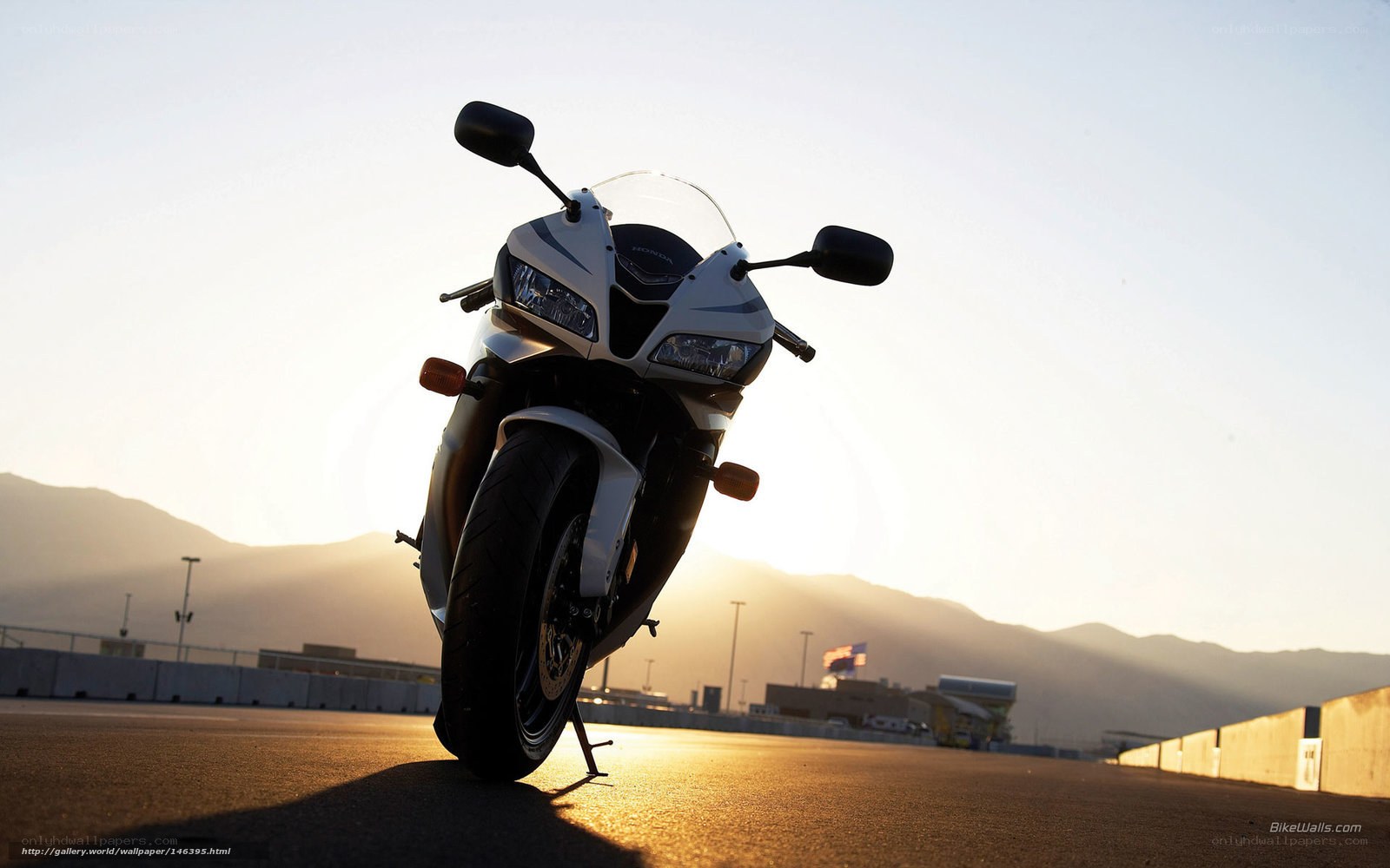 motorcycle on racetrack at sunset
