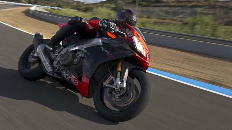Motorcycle on Racetrack — Black, Dynamic, Afternoon, Photograph, Rider, Helmet