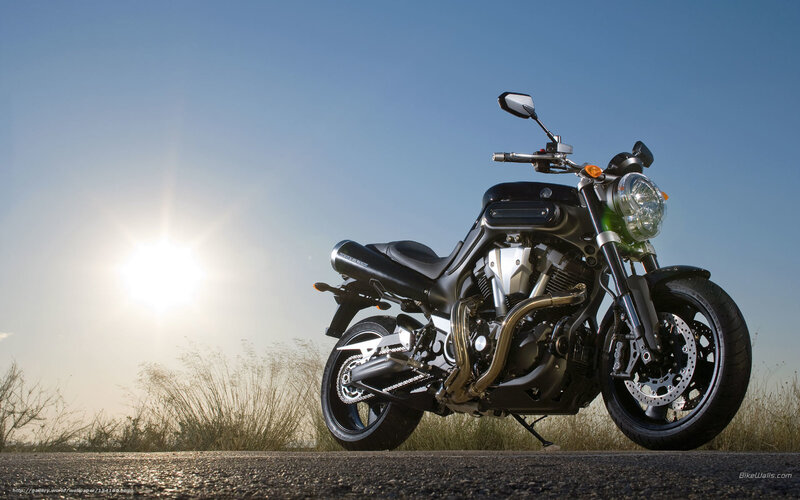 motorcycle on road at sunset