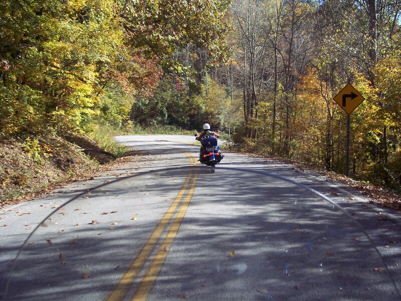 Motorcycle on Winding Road — Green, Serene