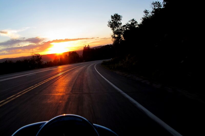 Motorcycle on Winding Road — Orange