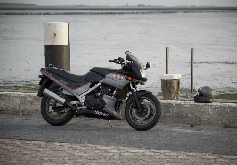 Motorcycle parked by the water