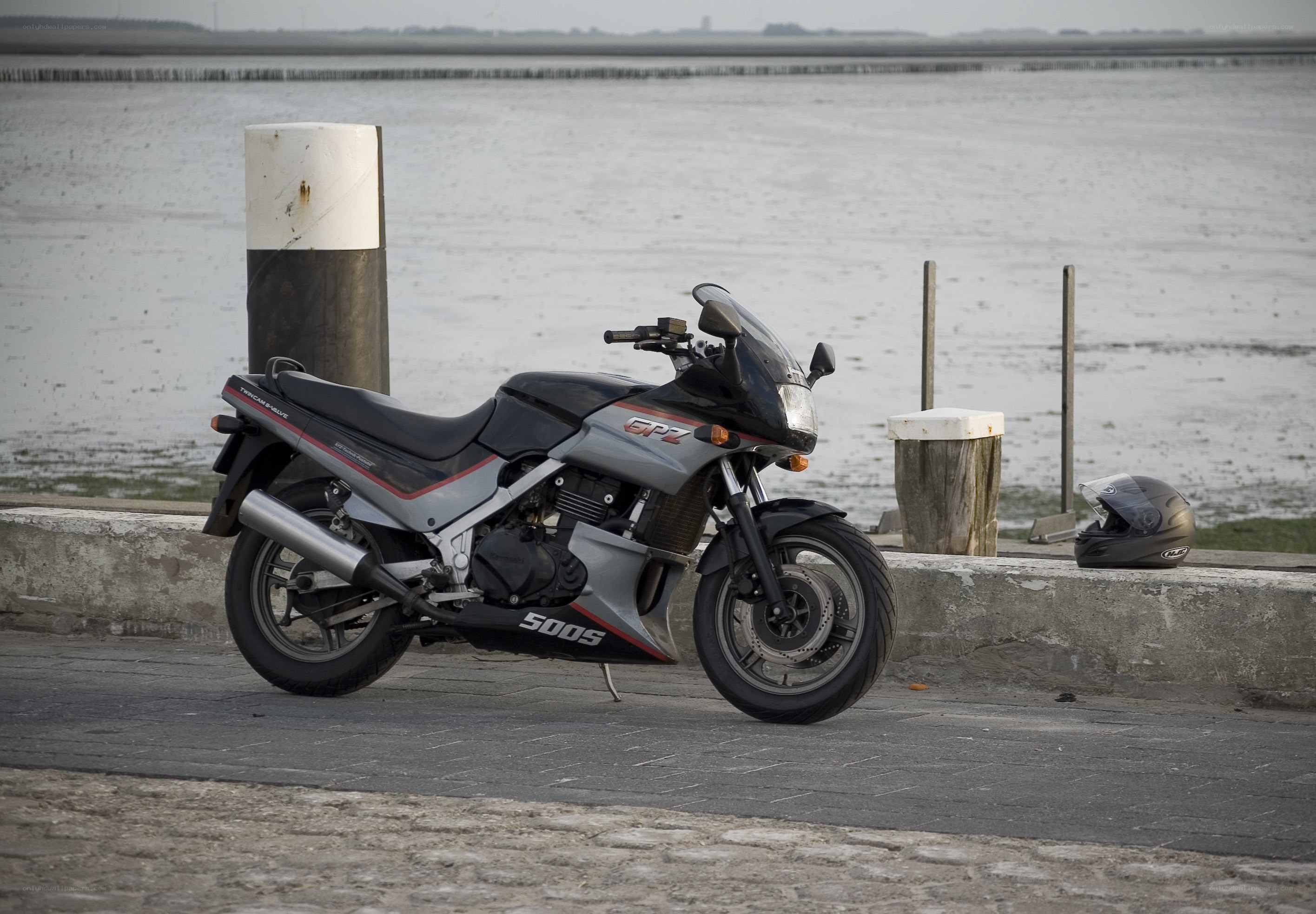 Motorcycle parked by the water