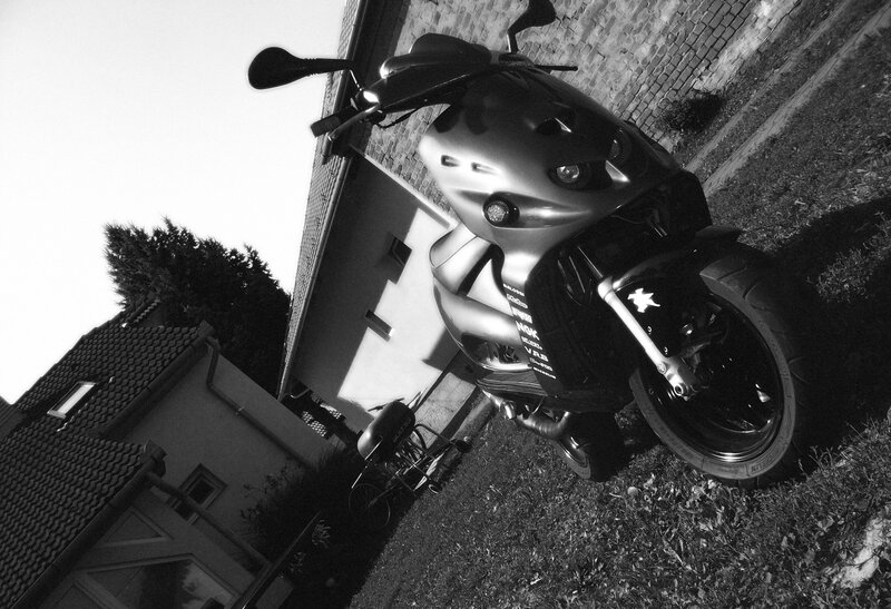 motorcycle parked outside house