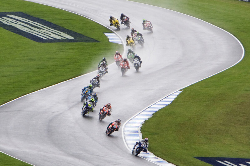 Motorcycle race on wet track
