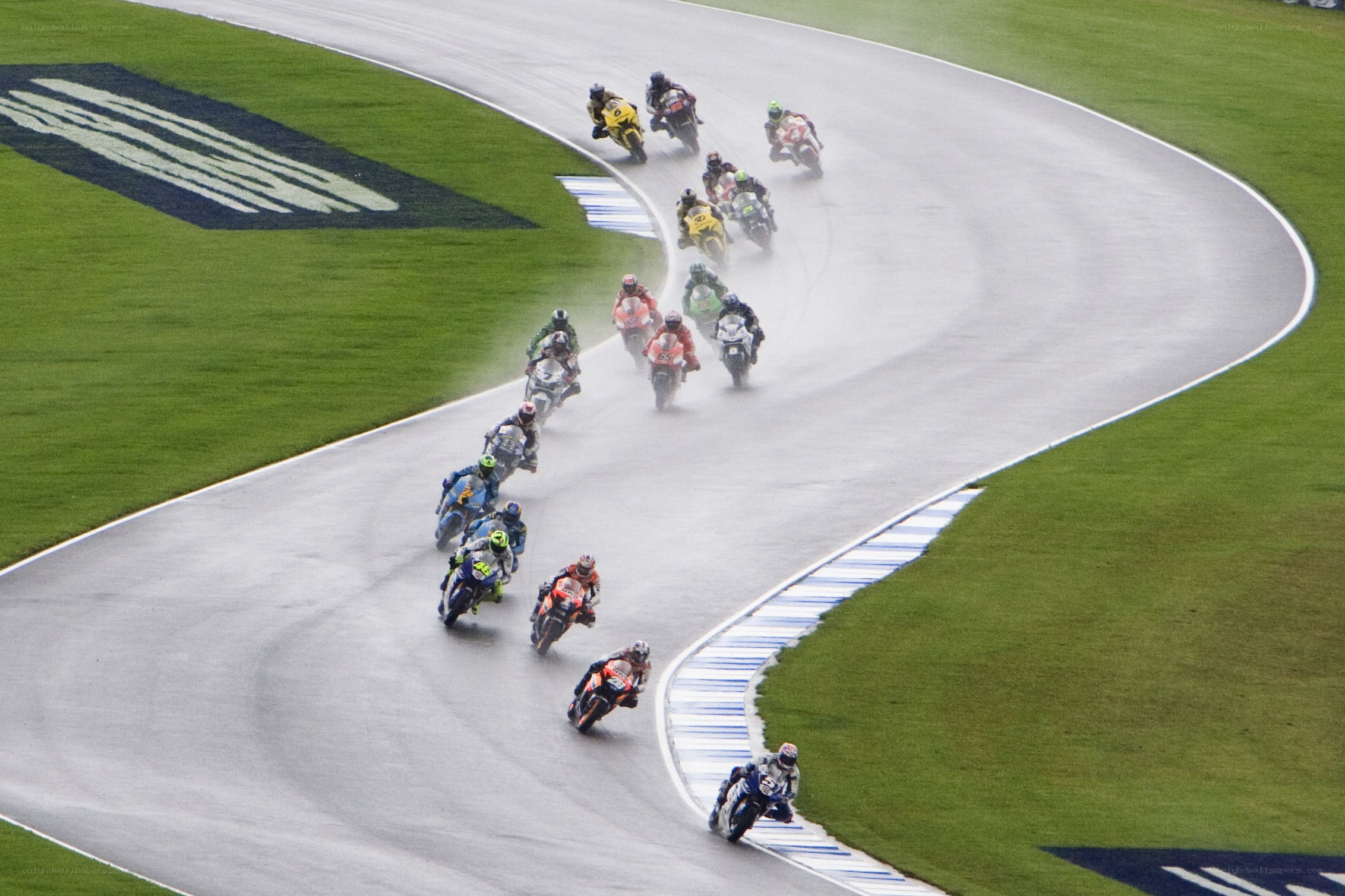 Motorcycle race on wet track