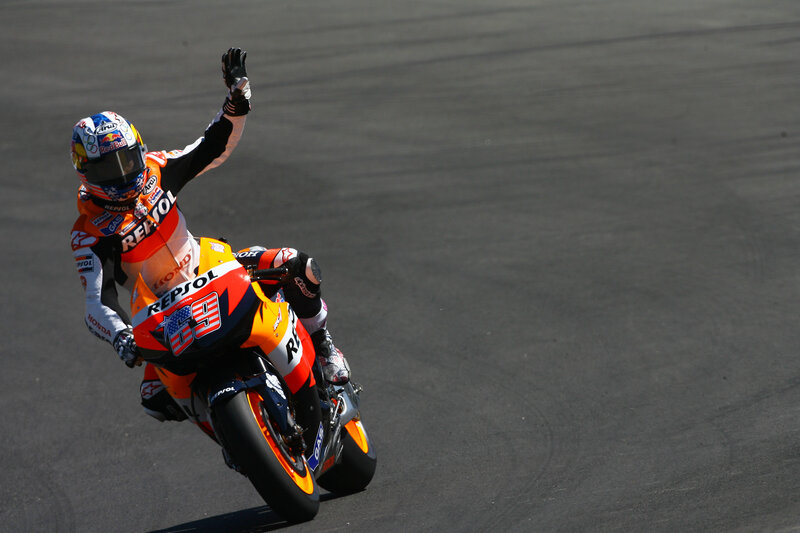 Motorcycle racer celebrating on track