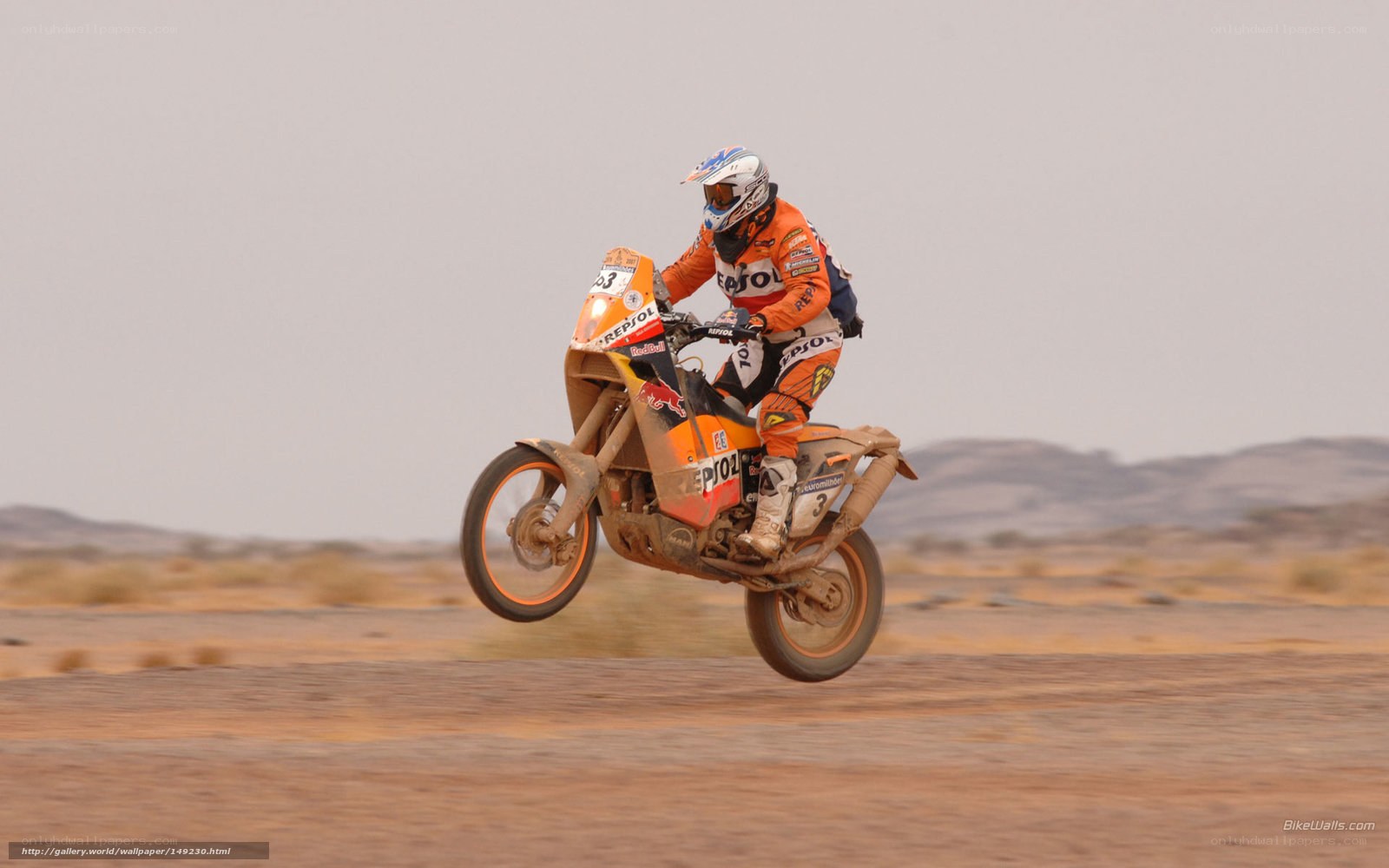 Motorcycle racer in desert