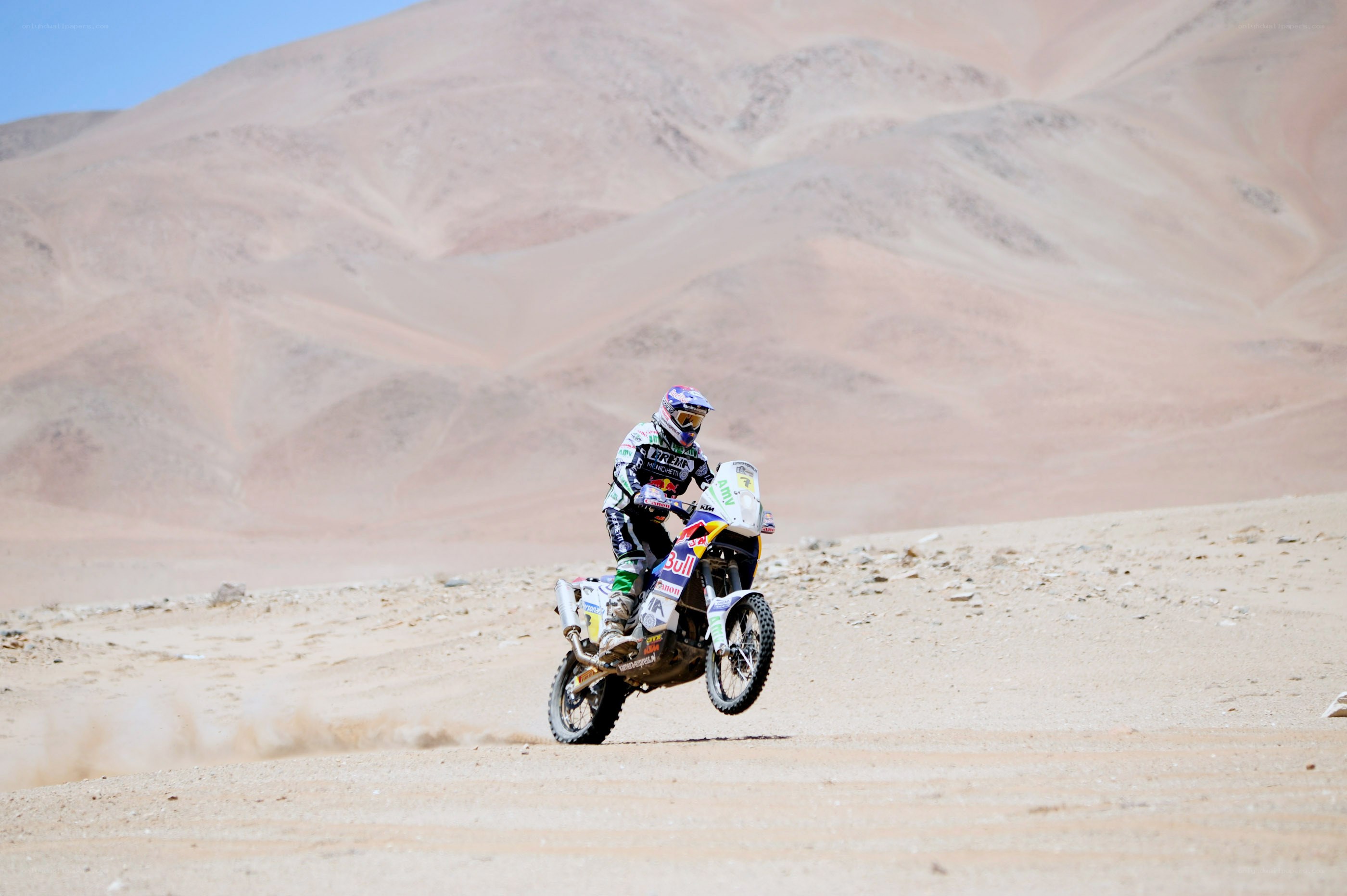Motorcycle racer in desert