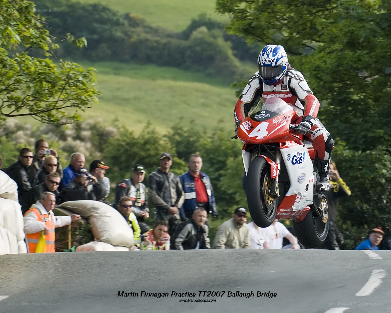 Motorcycle racer in mid-air