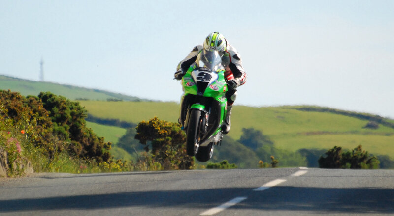 Motorcycle Racer in Mid-air — Green