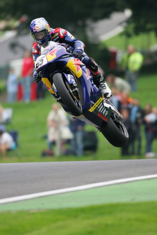 Motorcycle racer in mid-air jump