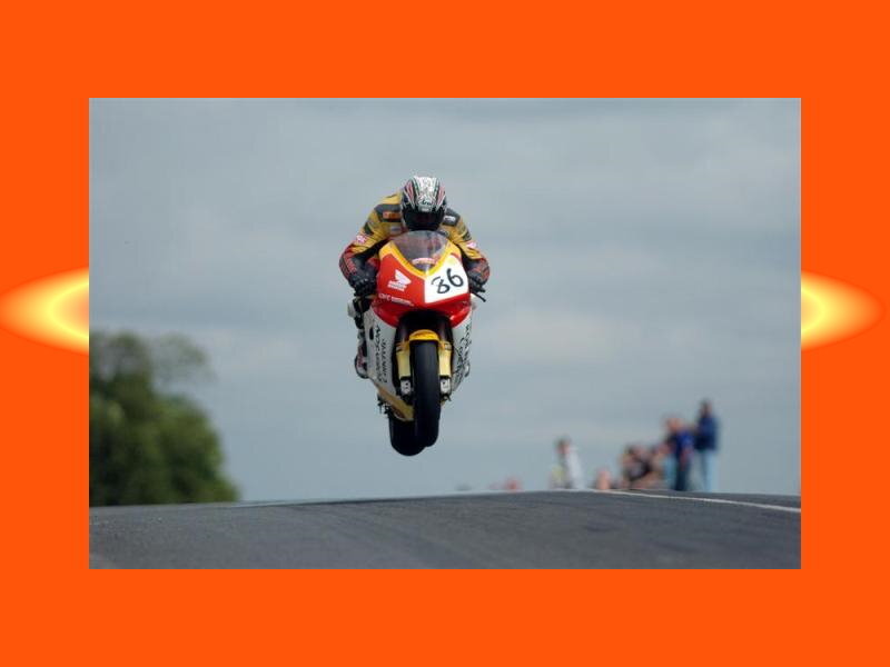 Motorcycle Racer in Mid-air — Orange