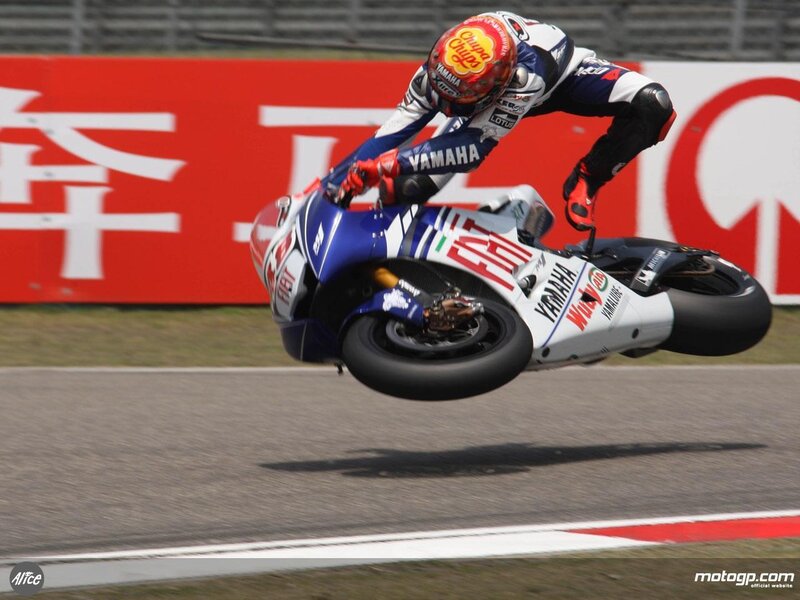 Motorcycle racer in mid-turn
