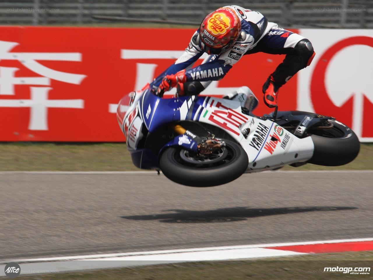 Motorcycle racer in mid-turn