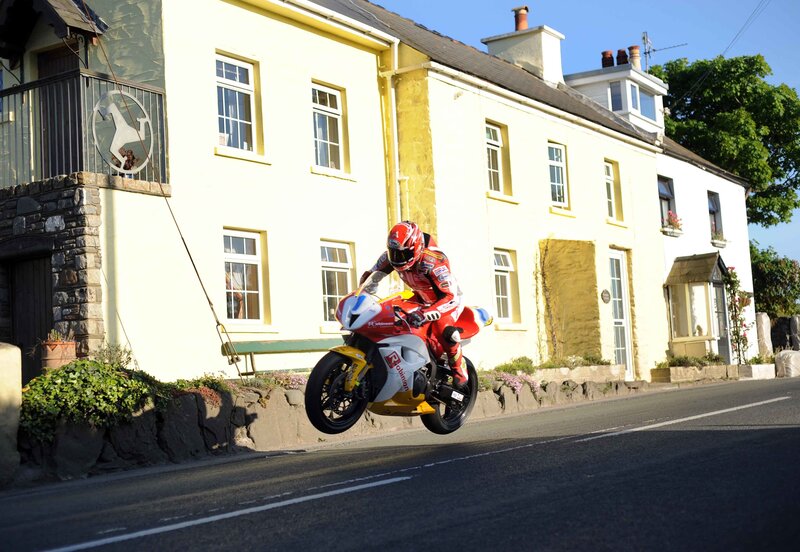 Motorcycle racer on a country road