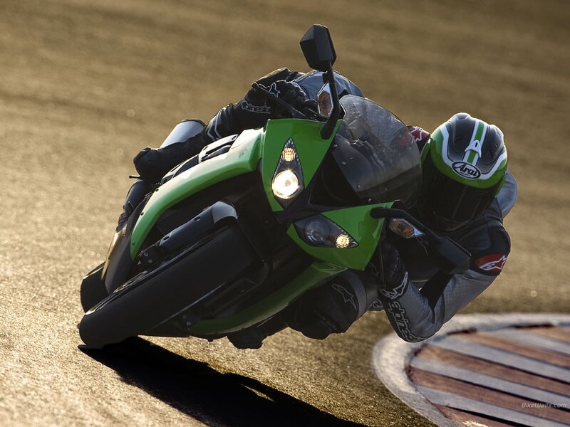 Motorcycle racer on a green bike