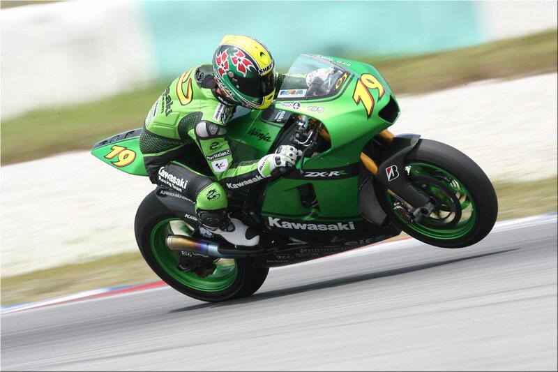 Motorcycle racer on a green bike