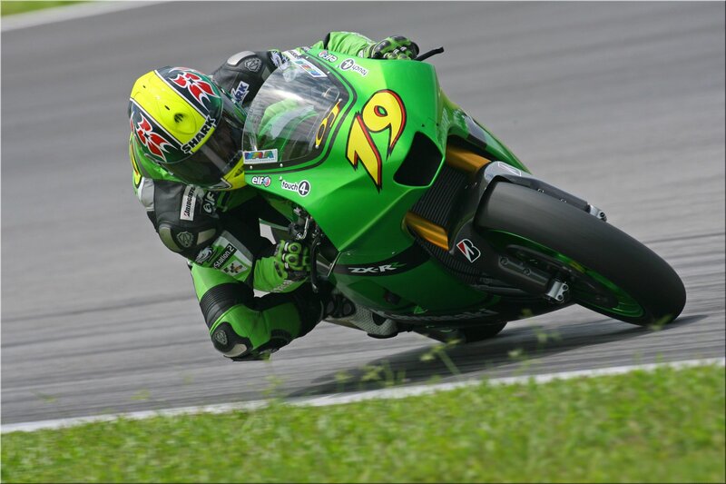 Motorcycle racer on a green bike