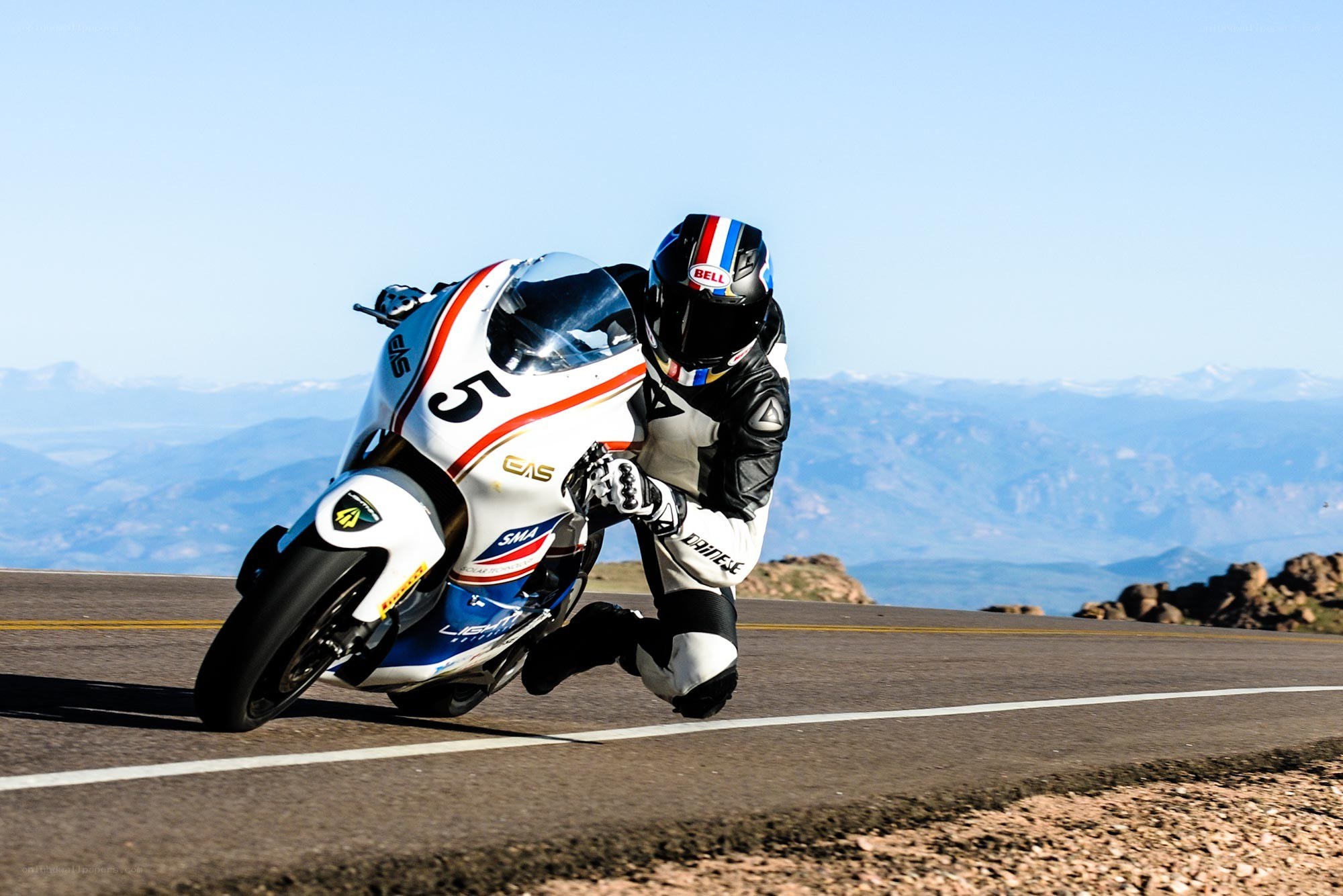 Motorcycle racer on a mountain road