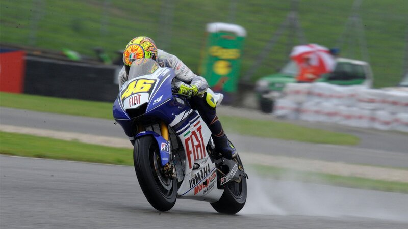 Motorcycle racer on a wet track