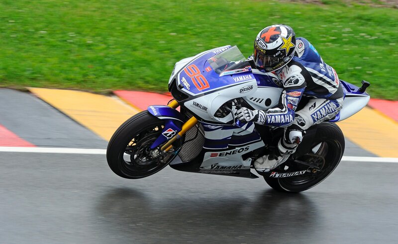 Motorcycle racer on a wet track