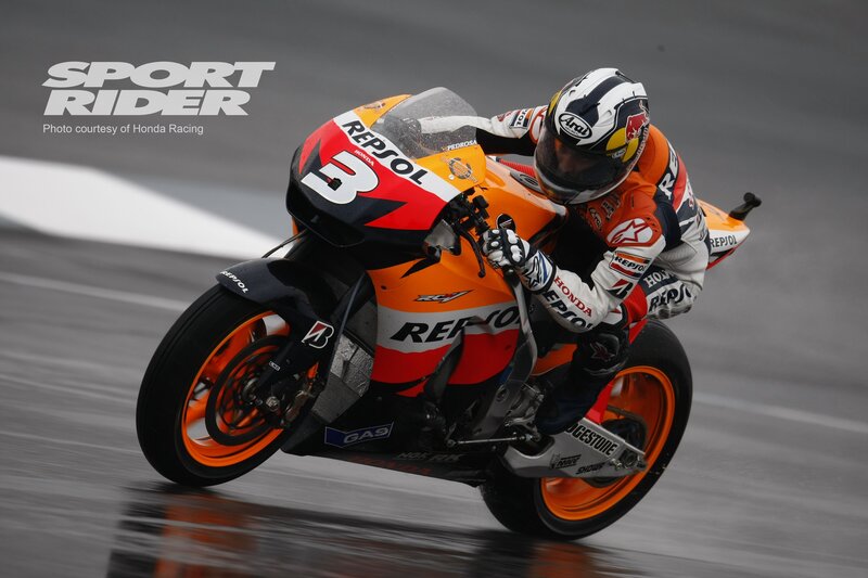 Motorcycle racer on a wet track