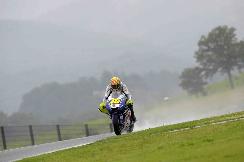 Motorcycle racer on a wet track