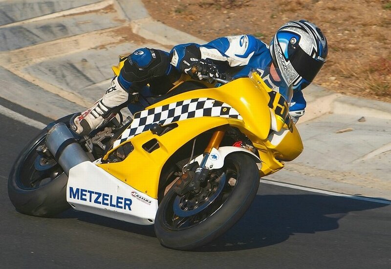 Motorcycle racer on a yellow bike