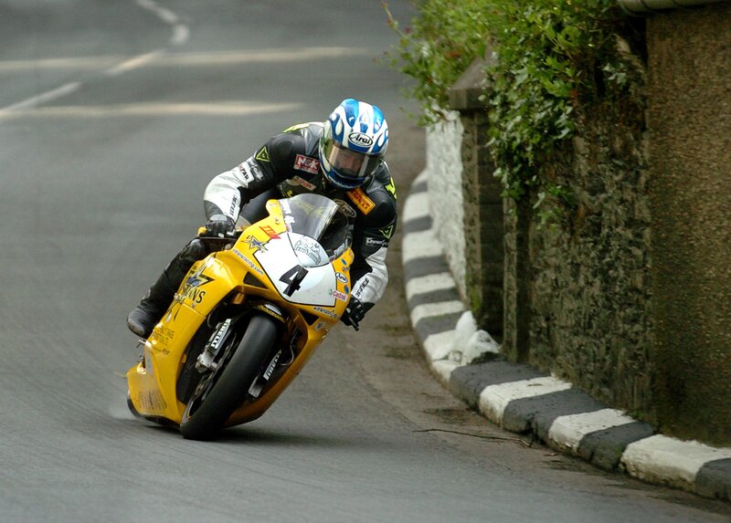 Motorcycle racer on a yellow bike