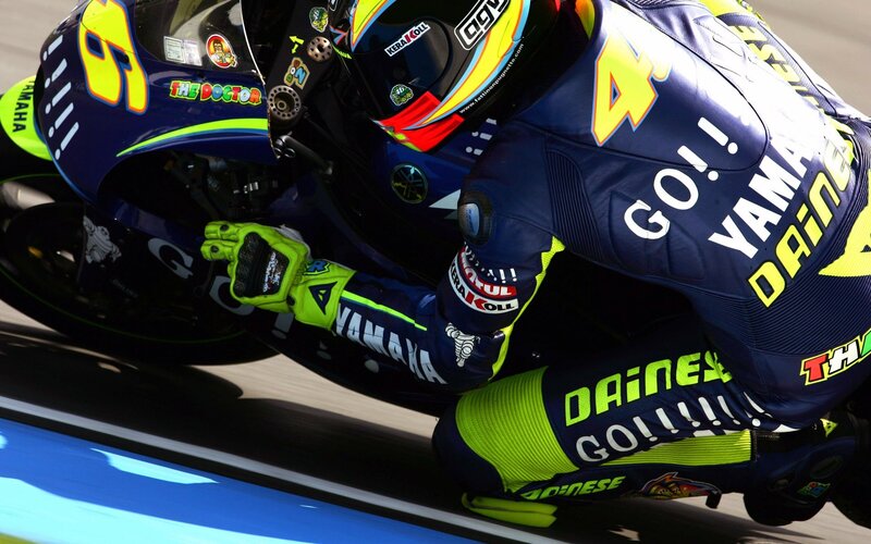 Motorcycle Racer on Bike — Blue, Dynamic, Afternoon, Photograph, Racing Suit, Helmet, Yamaha Motorcycle